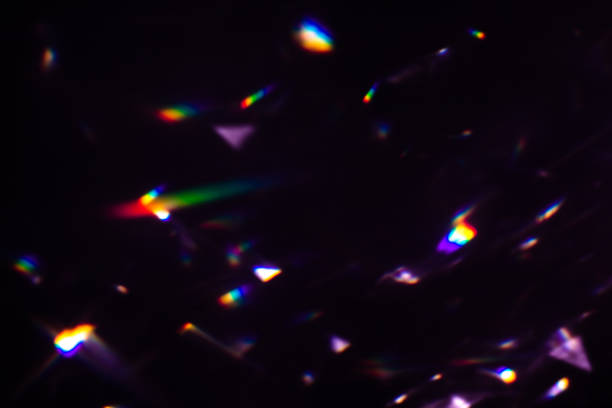istock colorful warm rainbow crystal light leaks on black background 1312050071