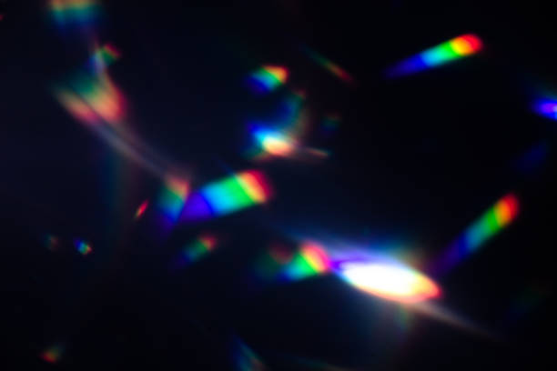 istock colorful warm rainbow crystal light leaks on black background 1312050095