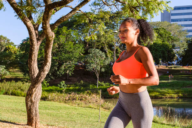 istock Woman sportsman practicing running in the park 1312052936