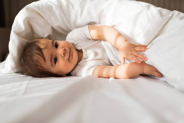 istock Beautiful baby on the bed 1312058215