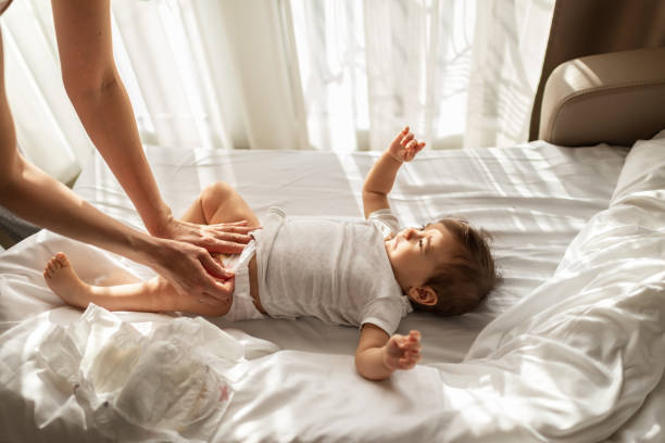 istock Mother taking care of baby 1312058285