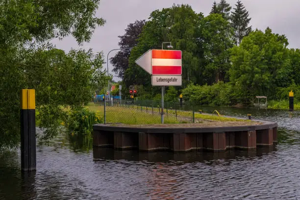 Sign: Lebensgefahr (German for - Danger to life), seen at the River Elde in Luebz, Germany