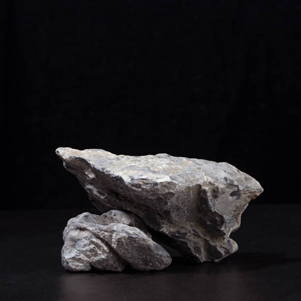 istock Stone podium for packaging and cosmetic presentation on black background, square. 1312059407