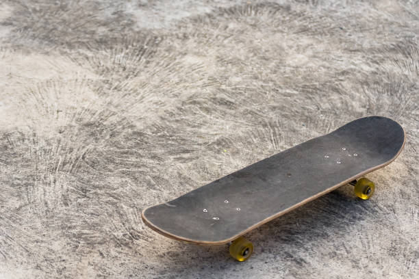 istock Close up surf skate or skateboard at park sunset 1312059693