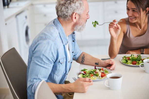 istock Close up of delighted couple enjoying their dinner 1312059817