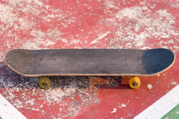 istock Close up surf skate or skateboard at park sunset 1312059840