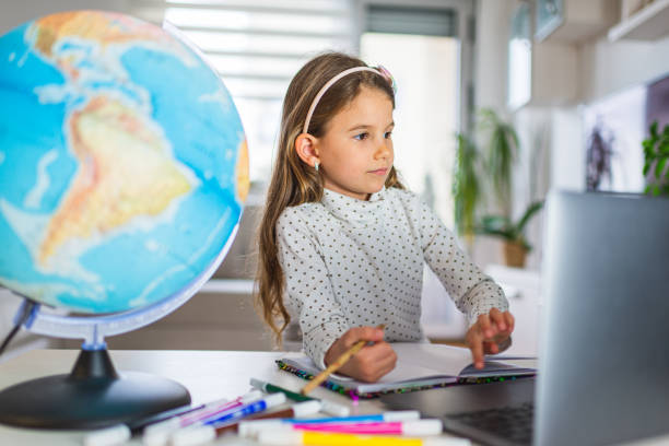 istock Beautiful girl homeschooling 1312061352