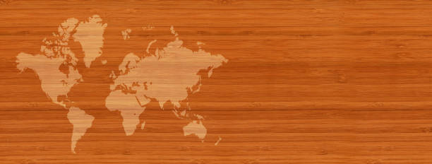 istock World map on brown wooden wall background. Horizontal banner 1312062603