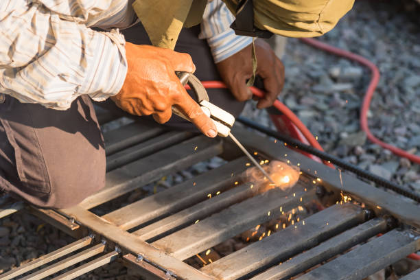 istock Man Welding in Workshop Sparks Metalwork Construction Industrial 1312063442