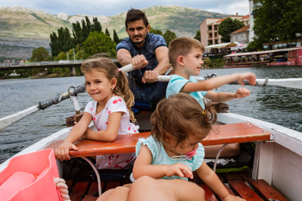 istock Young family enjoying boat ride 1312063523