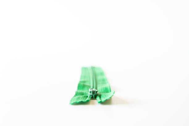 flat green zipper. - thimble sewing item close up studio shot imagens e fotografias de stock