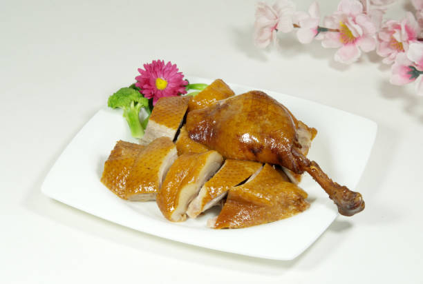 istock Roast duck cut into pieces on a white plate, delicious food 1312063871
