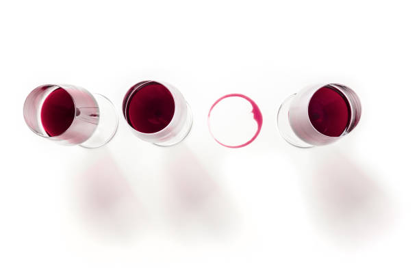 istock Red wine, three glasses and a wine stain, shot from the top 1312067156