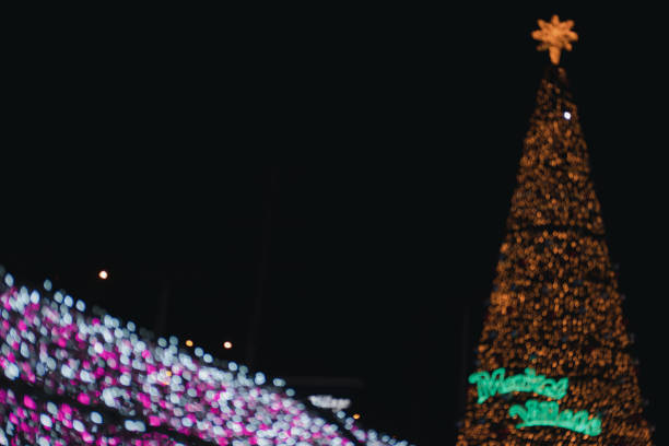 istock Blur background big Christmas tree structure on dark background at night 1312068156