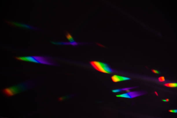 istock colorful warm rainbow crystal light leaks on black background 1312069863