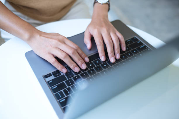 istock a woman working and typing on laptop computer keyboard on the table 1312069866