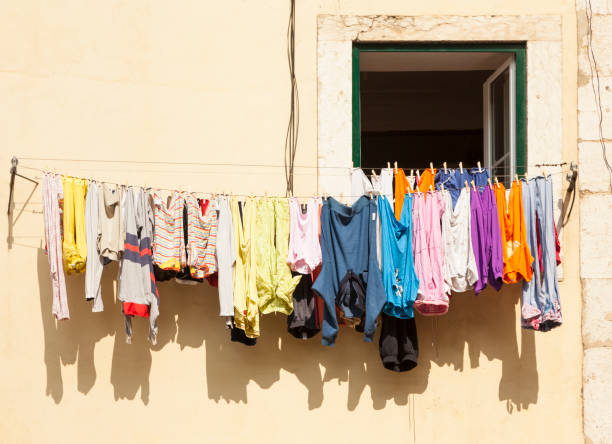 istock colorful clothes drying on line at Lisbon house 1312070779