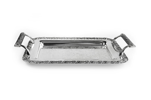 Antique silver tray with handles. Old luxury tray isolated on white background with clipping path. Closeup, front view.