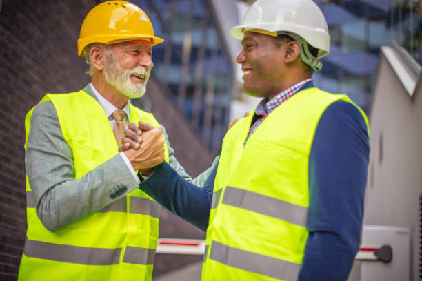 istock Mature engineer discussing the structure of the building with architects colleague at construction site. 1312072649