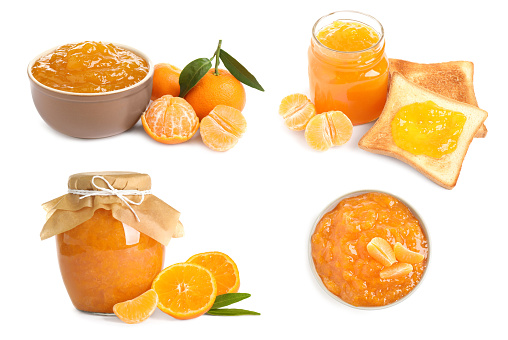 Set with delicious tangerine jam on white background