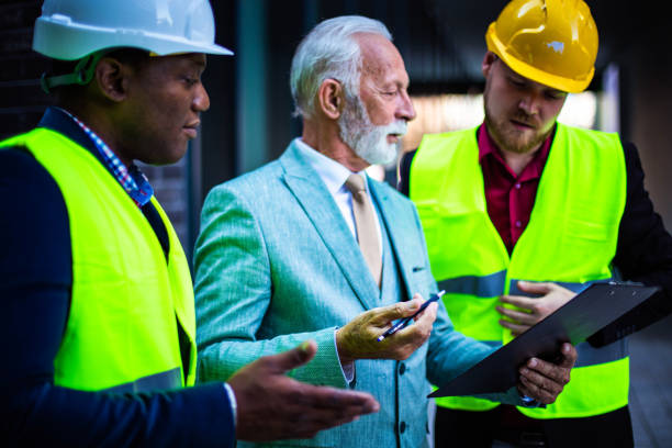 istock The construction site boss has a conversation with the architects. 1312073817
