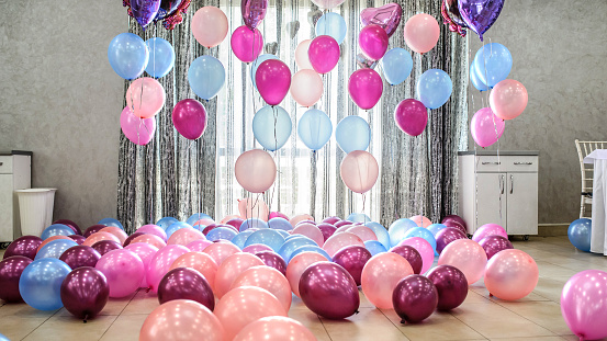 party decoration with pink and blue balloons in a restaurant