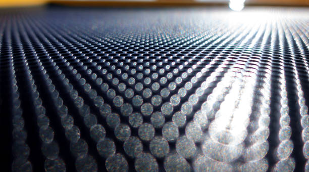 istock Abstract metallic background with round holes 1312075902