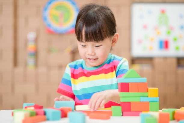istock Young Girl Playing Creative Toy Blocks For Homeschooling 1312077846