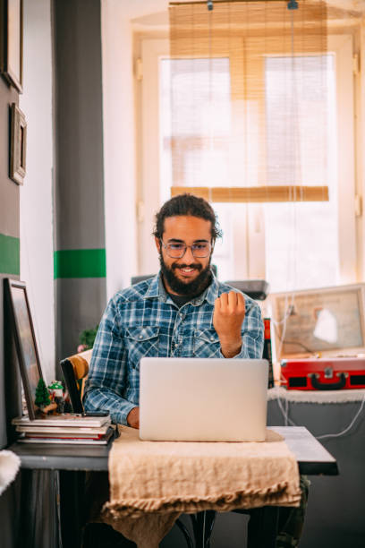 istock Young Man Having a Video Call With Sign Language on Laptop 1312078054