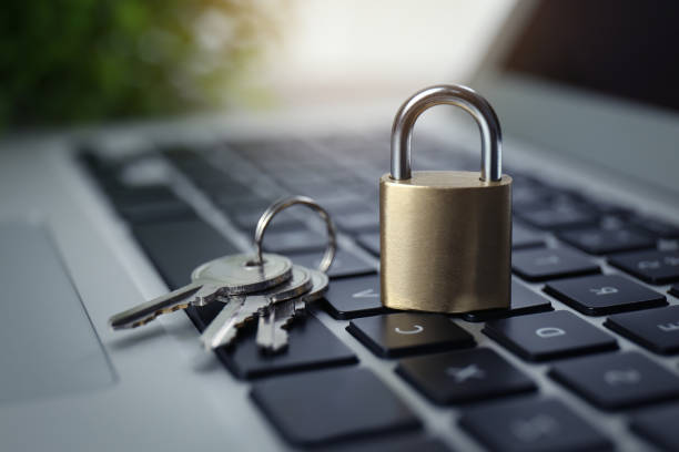 istock Metal padlock and keys on laptop keyboard, closeup. Cyber security concept 1312083844