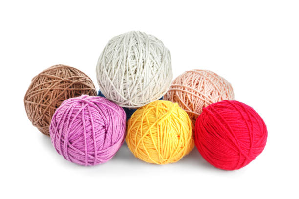 istock Soft colorful woolen yarns on white background 1312083940