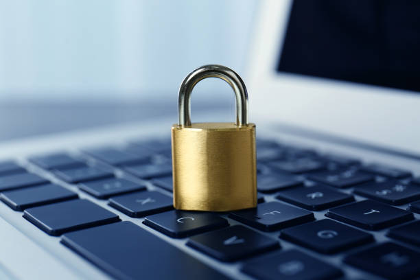 istock Metal padlock on laptop keyboard, closeup. Cyber security concept 1312084145