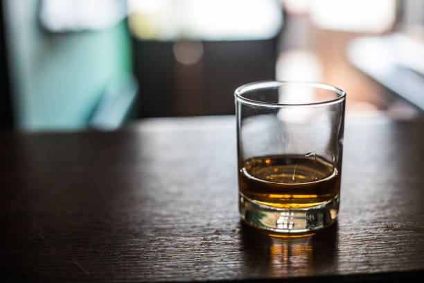 istock Whisky glass on a wooden surface 1312085399