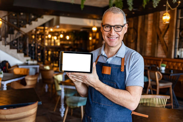 istock Barista showing digital tablet with blank screen 1312086554
