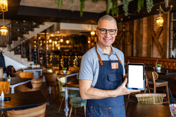istock Barista showing digital tablet with blank screen 1312086557