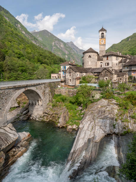 istock Waterfall and typical stone village in Ticino 1312088637