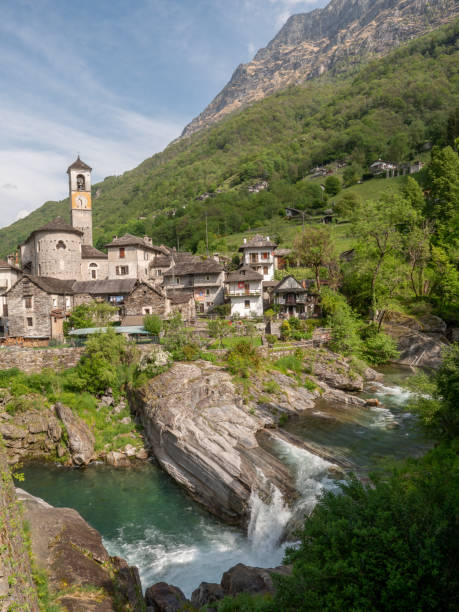 istock Waterfall and typical stone village in Ticino 1312088720
