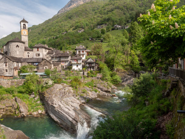 istock Waterfall and typical stone village in Ticino 1312088794