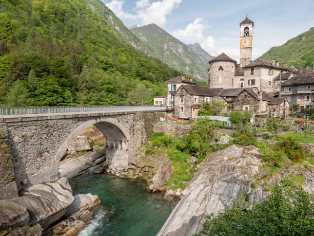 istock Waterfall and typical stone village in Ticino 1312089335