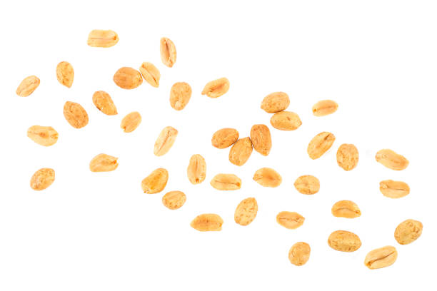 istock Roasted salted peanuts isolated on a white background, top view. Pile of fried peanuts. 1312089948