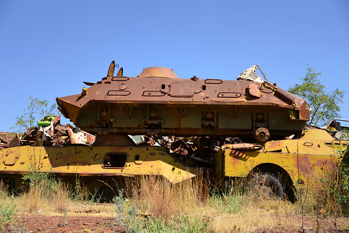 Asmara, Eritrea: tank graveyard, a giant pile of junk in a field, no payment required for access - wheel-less BTR-60PB Soviet eight-wheeled armoured personnel carrier (APC) on top a similar model and a BRDM-2 (right) - piles of rusted machinery left over from the 30-year long Eritrean War of Independence.