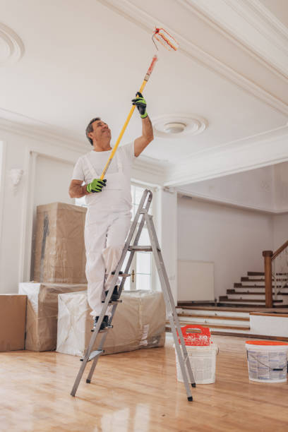 istock Male painter painting a ceiling 1312092923