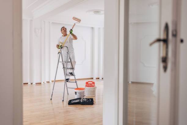 istock Male painter painting a ceiling 1312092935