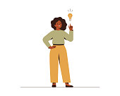 istock Black woman points on light bulb over her. Happy African female entrepreneur has business idea. Concept of innovation, solution and creativity. 1312094304