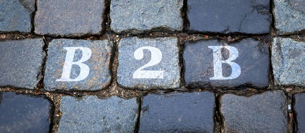 istock B2B is written on a wet stone gray wall in big letters. 1312095056
