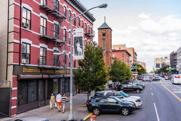 New York City, United States - August 25, 2017: Harlem neighborhood, Manhattan. On the Martin Luther King Boulevard with the Church of St. Joseph and the Holy Family