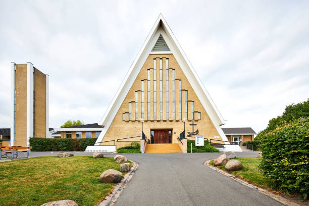 istock a yellow old triangle church building in denmark 1312097679