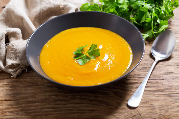 istock plate of pumpkin soup with parsley 1312097915