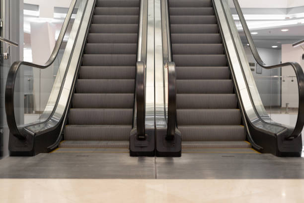 istock Escalator store empty in the mall two lanes up and down. 1312099746