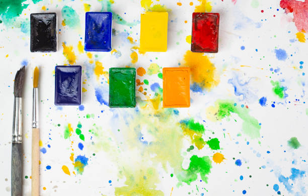 istock Watercolor and brushes at bright background. Flat lay, top view. 1312101169